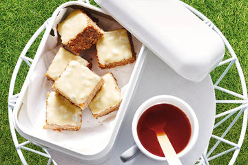 Ginger and sesame bars with passionfruit tahini drizzle